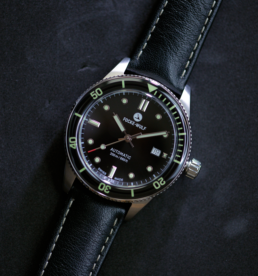Focke-Wulf watch with black dial and leather strap on a dark background