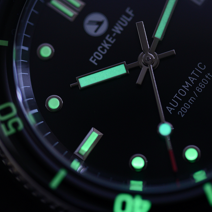 Close-up of a Focke-Wulf watch with green glowing elements on a dark background