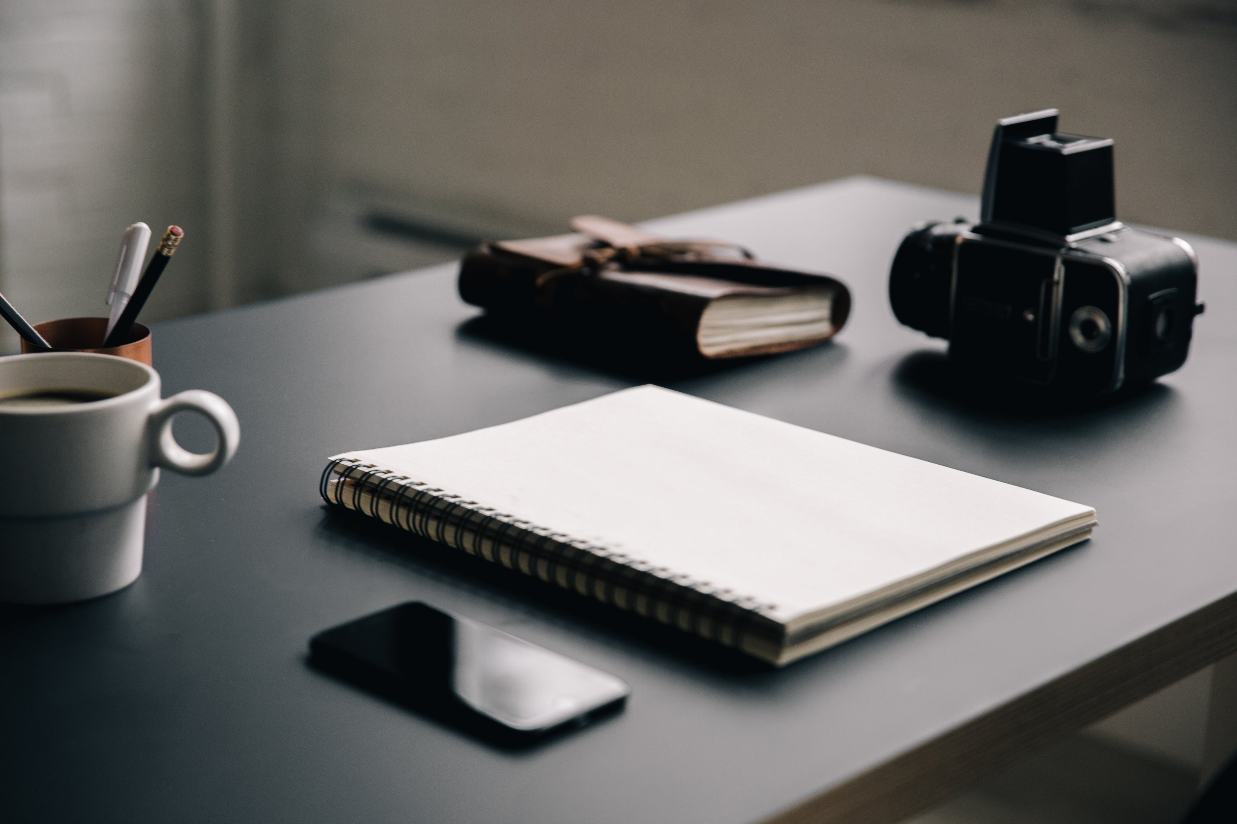 blank-notebook-on-creative-workspace.jpg