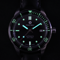 Focke-Wulf watch with glowing green face on a black background